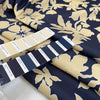Printed polyester cinzato with floral design in dark blue, ecru, and yellow, very crunchy and not transparent, ideal for structured garments and bold pieces. High-quality deadstock collected in Stock from a Maison de Couture in Italy.