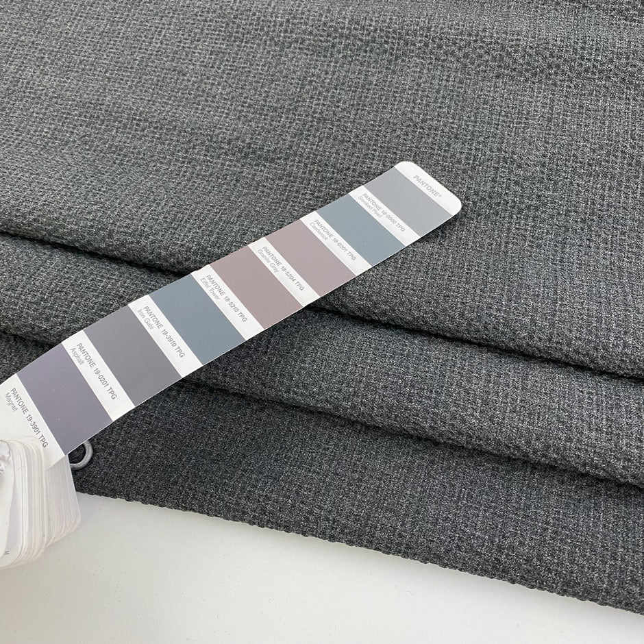 Light gray polyester seersucker with a crisp, puckered texture. Perfect for airy, wrinkle-resistant garments. High-quality deadstock collected in Stock from a Maison de Couture in Italy.