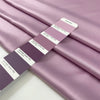 Lilac matte polyester satin with a soft hand and elegant drape, perfect for dresses, linings, and fluid pieces. High-quality deadstock collected in Stock from a Maison de Couture in Italy.