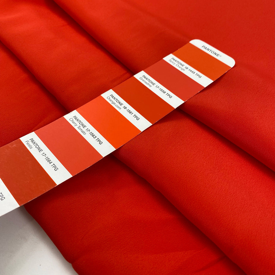 Crepe de chine in acetate and silk, very soft and light, in lobster orange. High-quality deadstock fabric by the meter collected in Stock from a Maison de Couture in Italy.