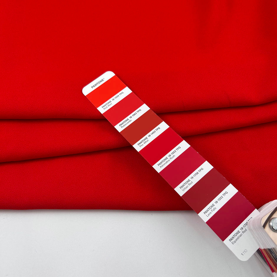 Red viscose-acetate crepe cady, soft, fluid and non-stretch. Perfect for trousers. High-quality deadstock collected in Stock from a Maison de Couture in Italy.