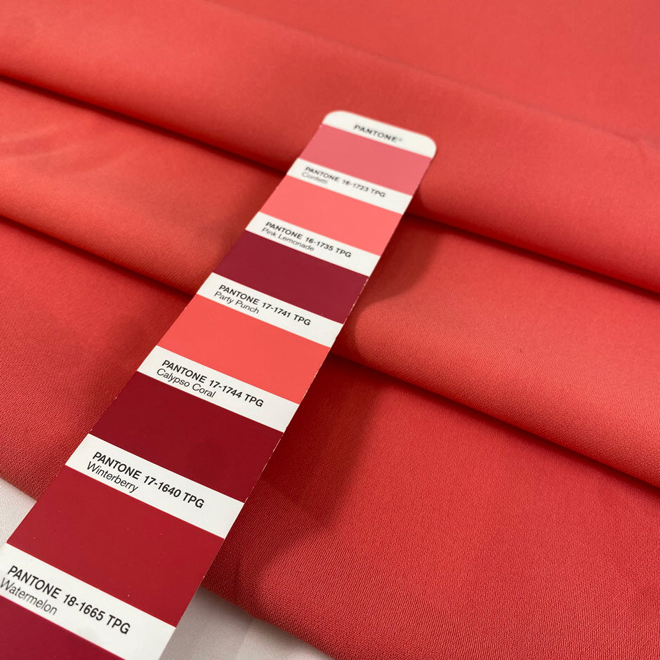 Polyester cady in calypso coral, very soft, flowy and with a matte finish. Ideal for trousers, skirts, dresses and jackets. High-quality deadstock collected in Stock from a Maison de Couture in Italy.