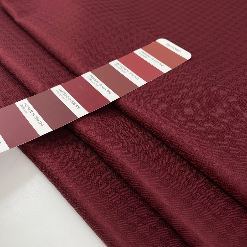 Pure soft silk twill with jacquard textured in pomegranate red.&amp;nbsp;High-quality deadstock fabric collected in Stock from a Maison de Couture in Italy.