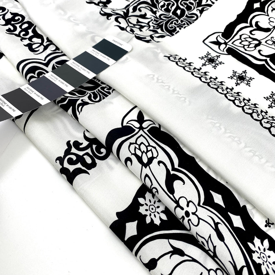 Pure silk satin printed with a panel design in black and white. Very soft and light. High-quality deadstock fabric collected in Stock from a Maison de Couture in Italy.