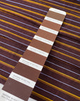 Pure silk shantung in dark brown with textured yellow and light blue stripes. Characteristic raw texture of shantung, ideal for dresses and skirts. High-quality deadstock collected in Stock from a Maison de Couture in Italy.
