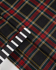 Dark multicolored falling pure wool tartan. High-quality deadstock fabric collected in Stock from a Maison de Couture in Italy.