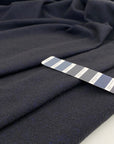 Blend of virgin wool, polyamide and linen in dark blue and black.&nbsp;High quality deadstock fabric.