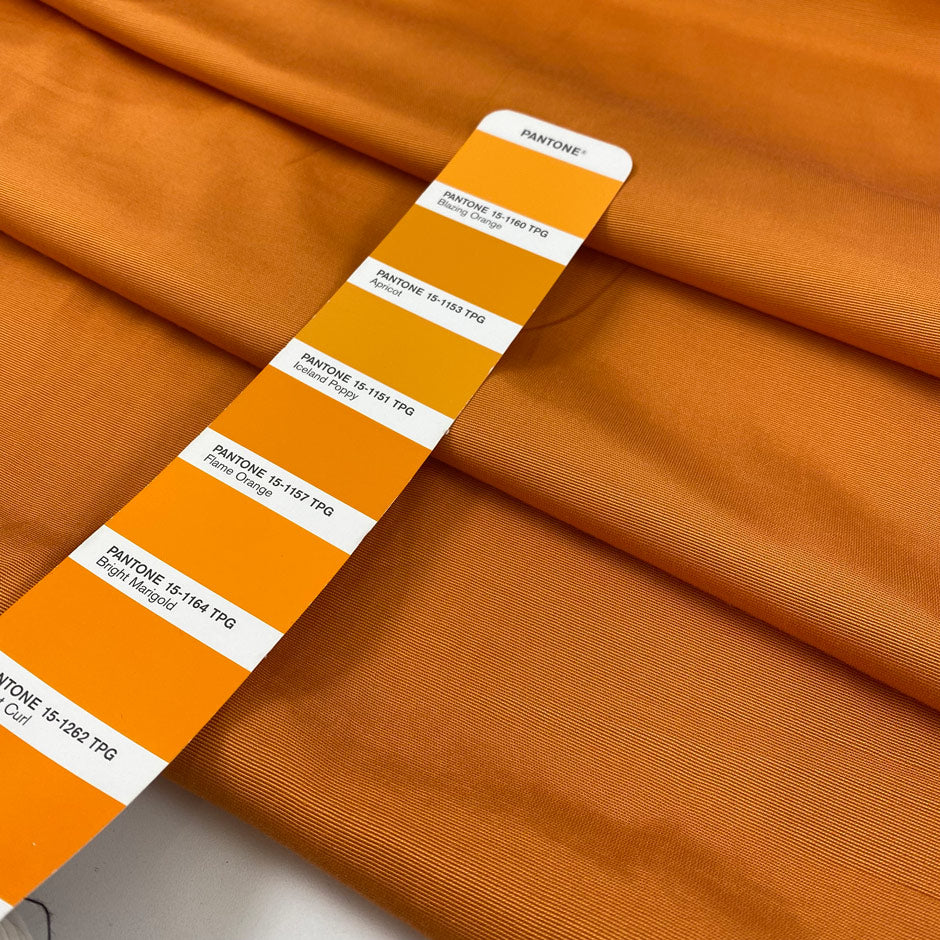 Pure viscose in apricot orange very soft, light, and flowy. High-quality deadstock fabric by the meter collected in Stock from a Maison de Couture in Italy.
