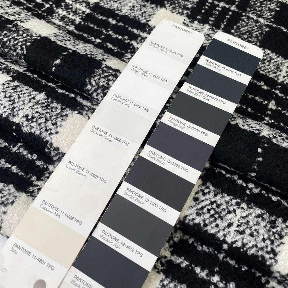 Very soft and warm wool blend with check design in the shades of black and white, color reference Coconut Milk and Forest River. Ideal for coats and jackets. High-quality deadstock collected in Stock from a Maison de Couture in Italy.