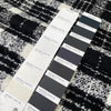 Very soft and warm wool blend with check design in the shades of black and white, color reference Coconut Milk and Forest River. Ideal for coats and jackets. High-quality deadstock collected in Stock from a Maison de Couture in Italy.