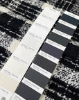 Very soft and warm wool blend with check design in the shades of black and white, color reference Coconut Milk and Forest River. Ideal for coats and jackets. High-quality deadstock collected in Stock from a Maison de Couture in Italy.