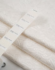 White soft jacquard matelasse. High quality deadstock fabric.