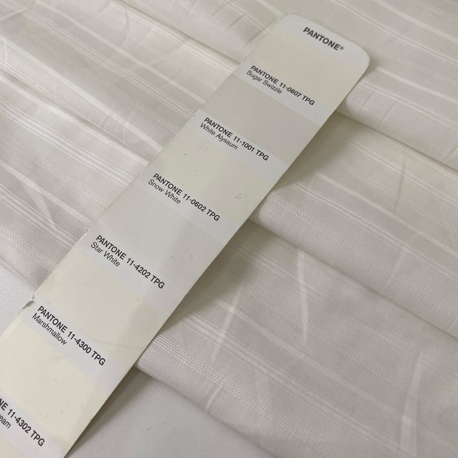 Very soft and light pure cotton batiste in white with delicate stripe design. Ideal for shirting and dresses. High-quality deadstock collected in Stock from a Maison de Couture in Italy.