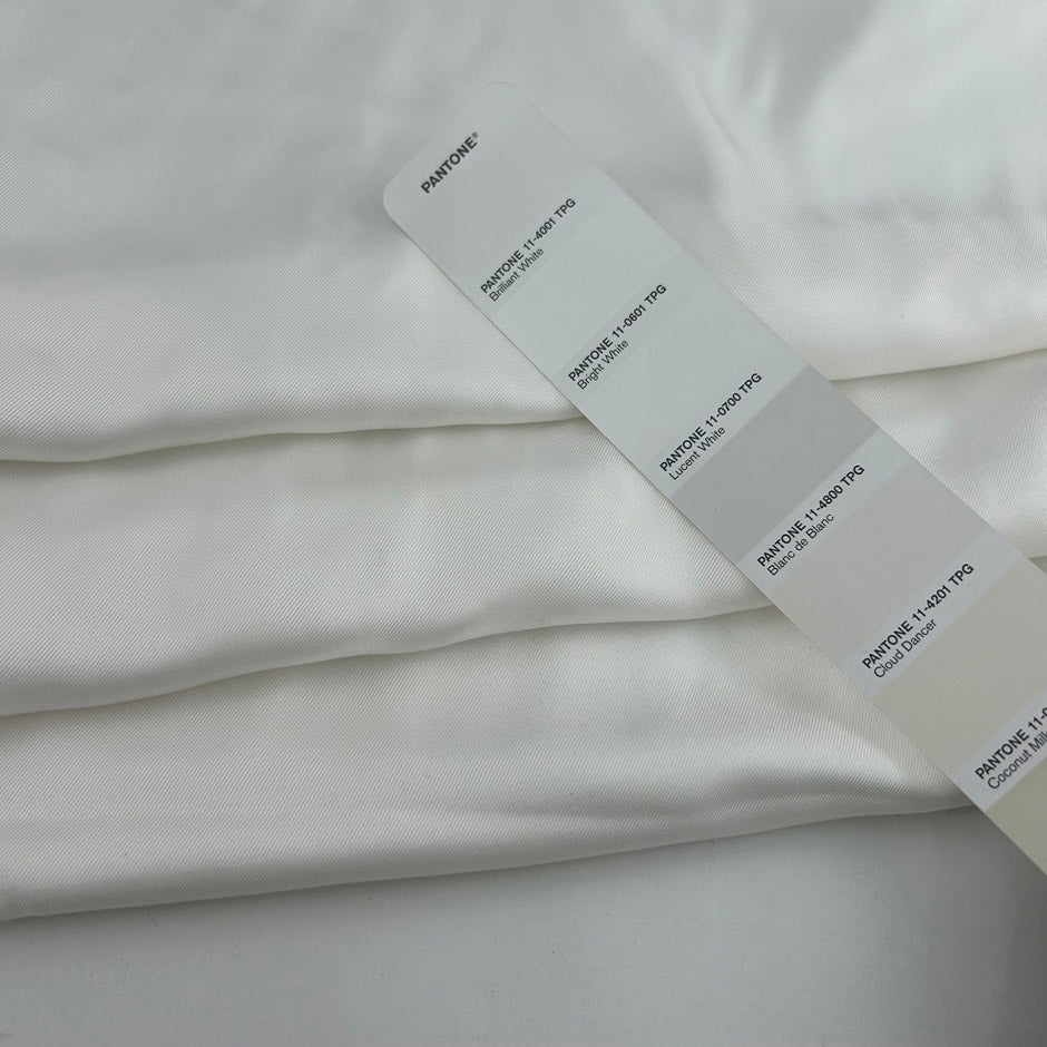 White pure silk twill, soft, fluid and non-stretch. Perfect for dresses and blouses. High-quality deadstock collected in Stock from a Maison de Couture in Italy.