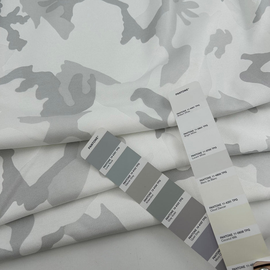 White pure cotton French terry with camouflage print, soft and non-stretch. High-quality deadstock collected in Stock from a Maison de Couture in Italy.