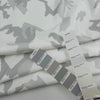 White pure cotton French terry with camouflage print, soft and non-stretch. High-quality deadstock collected in Stock from a Maison de Couture in Italy.
