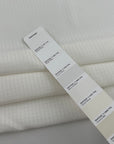 White silk-blend crepe de chine with micro jacquard pattern and non-stretch. High-quality deadstock collected in Stock from a Maison de Couture in Italy.