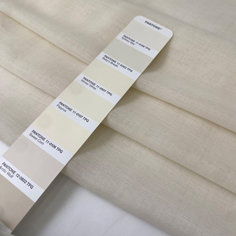 Pure wool muslin in light vanilla color reference Winter White. Very soft, light, and warm, with slight transparency. Flowy and ideal for scarves, light shirting, and dresses. High-quality deadstock collected in Stock from a Maison de Couture in Italy.