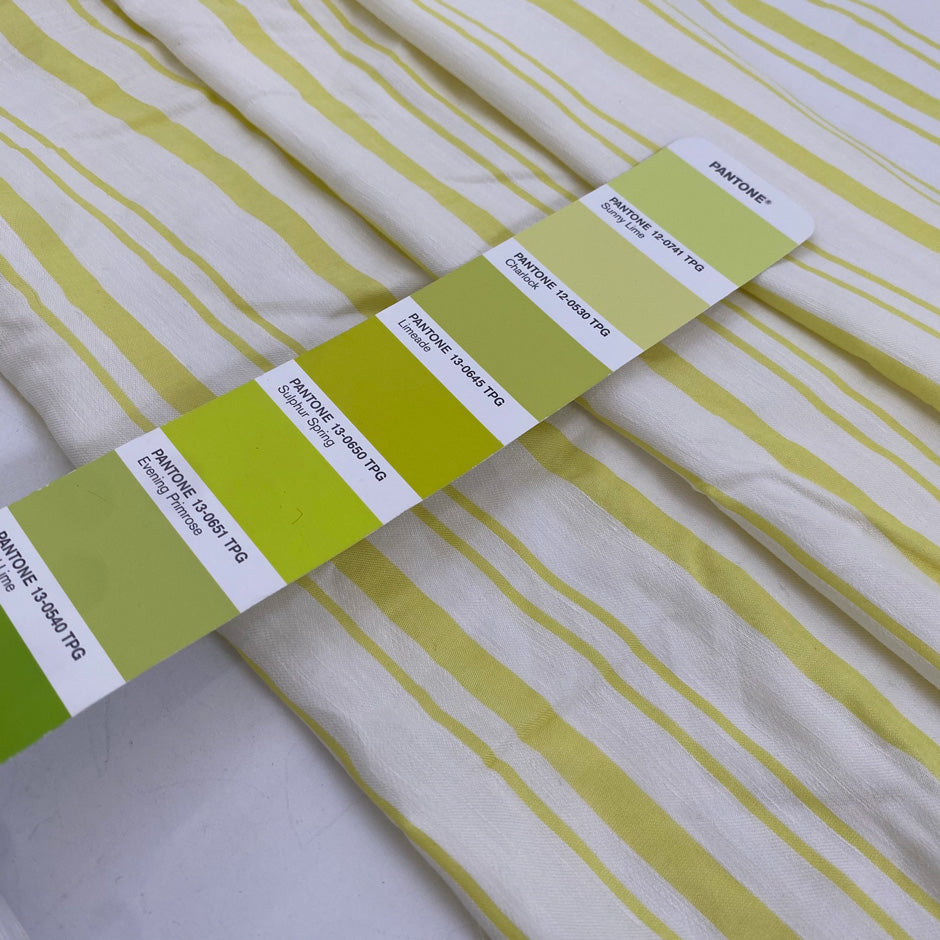 Linen and viscose with white ground and bright Charlock yellow stripes. Very soft and flowy. Ideal for dresses, blouses, skirts, and shirts.&nbsp;High-quality deadstock fabric by the meter collected in Stock from a Maison de Couture in Italy