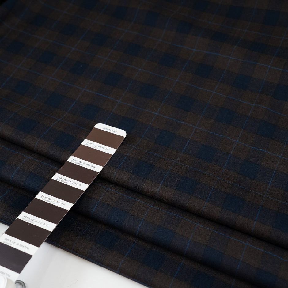 Lightweight blue and brown checked flannel pure virgin wool. High-quality deadstock fabric collected in Stock from a Maison de Couture in Italy.