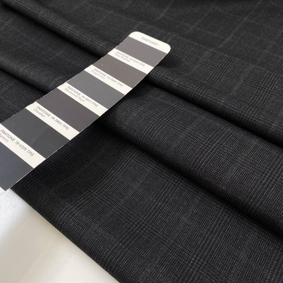 Pure wool in dark gray with classic Prince of Wales check. Elegant and versatile, ideal for suits, coats, and skirts. High-quality deadstock collected in Stock from a Maison de Couture in Italy.