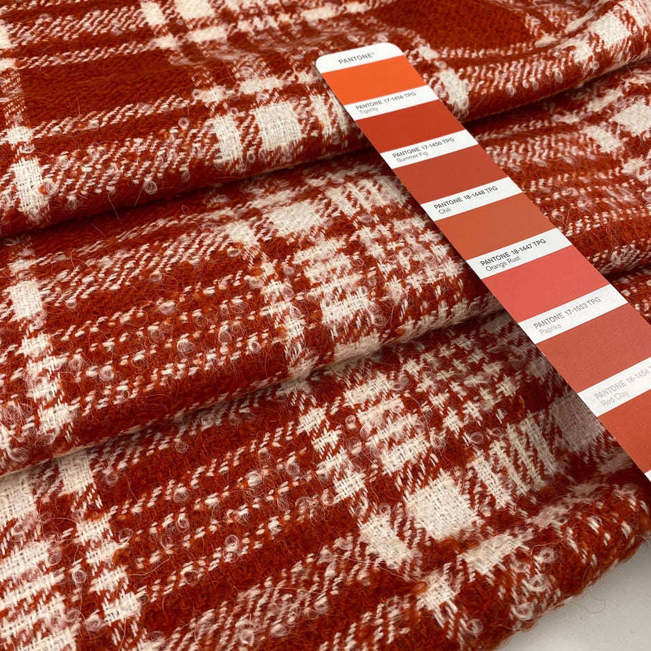 Soft checkered mixed wool tweed in orange and white. High quality deadstock fabric.