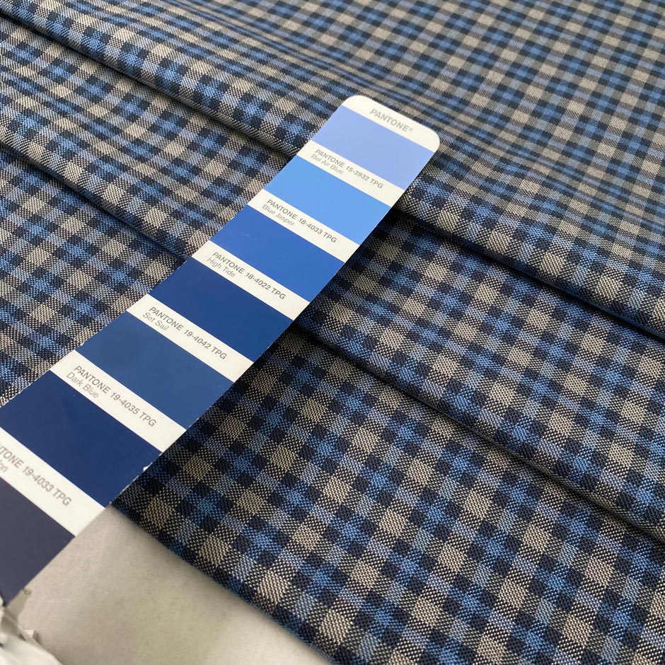 Mixed wool, silk, and cotton with a small check design in the shades of light blue and gray, color reference Blue Jasper. Very soft, medium weight, and flowy. Ideal for trousers, skirts, and jackets. High-quality deadstock collected in Stock from a Maison de Couture in Italy.