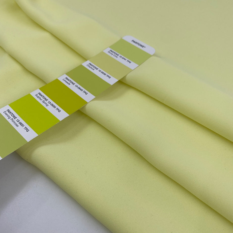 Polyester ligh cady in very bright yellow, very soft, flowy, not transparent. High-quality deadstock fabric collected in Stock from a Maison de Couture in Italy.