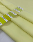 Polyester ligh cady in very bright yellow, very soft, flowy, not transparent. High-quality deadstock fabric collected in Stock from a Maison de Couture in Italy.