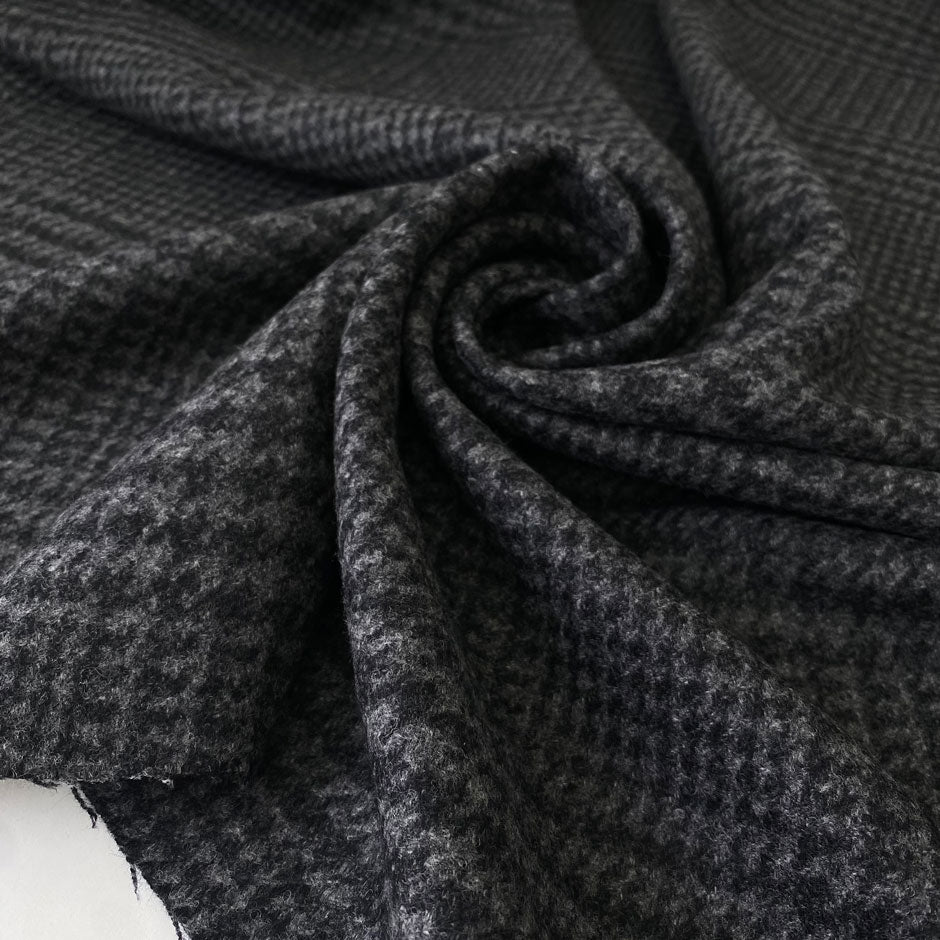 Elegant pure wool in dark gray and black pied de poule. Warm, soft, and ideal for light coats or jackets.High-quality deadstock collected in Stock from a Maison de Couture in Italy.
