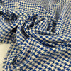 Mixed cotton tweed with a white ground and blue pied de poule pattern, color reference Victoria Blue. Very soft, light, flowy, and not transparent. Ideal for dresses, trousers, skirts, and jackets. High-quality deadstock collected in Stock from a Maison de Couture in Italy.