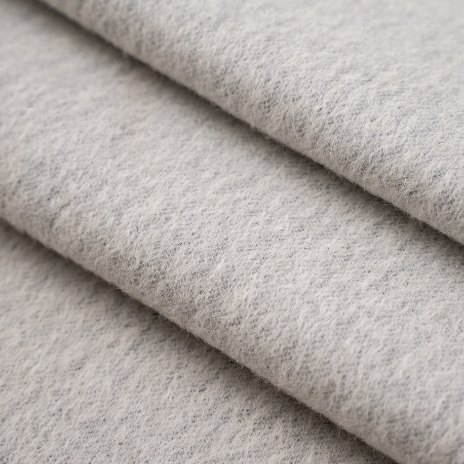 Alpaca and virgin hairy white selvedge wool fabric. High-quality deadstock fabric collected in Stock from a Maison de Couture in Italy.