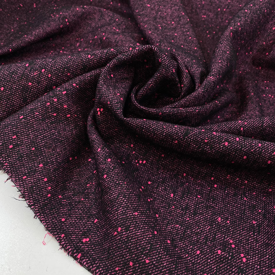 Soft and warm wool blend in vibrant fuchsia and black tones. A bold and cozy choice for coats, jackets, or winterwear.High-quality deadstock collected in Stock from a Maison de Couture in Italy.
