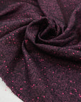 Soft and warm wool blend in vibrant fuchsia and black tones. A bold and cozy choice for coats, jackets, or winterwear.High-quality deadstock collected in Stock from a Maison de Couture in Italy.