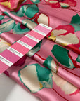 Pink polyester satin with floral printing. High-quality deadstock collected in Stock from a Maison de Couture in Italy.