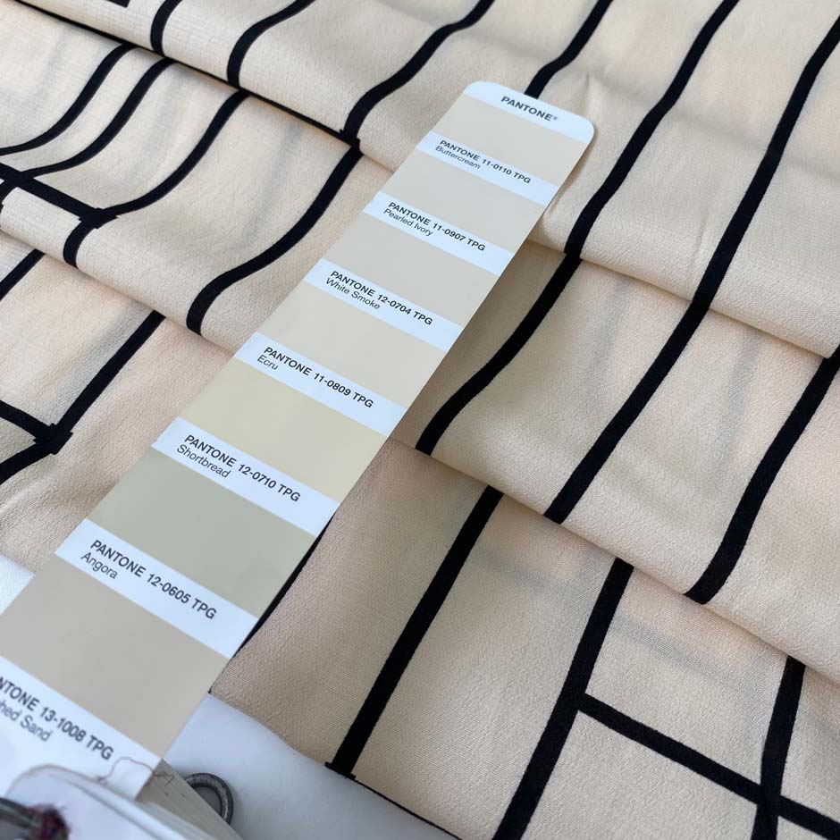 Pure viscose in light peach with a black geometric design. Very soft, flowy, and not transparent. Ideal for dresses, skirts, blouses, and shirting. High-quality deadstock collected in Stock from a Maison de Couture in Italy.