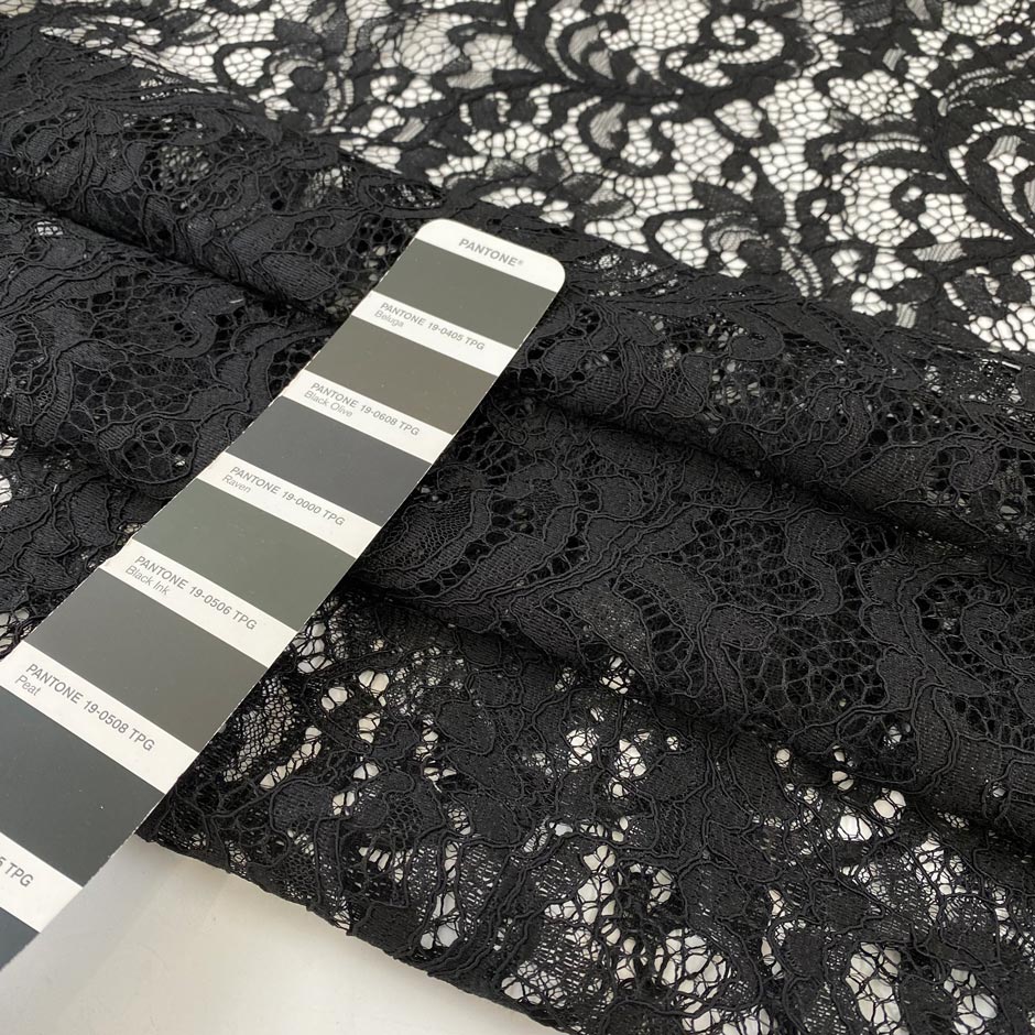 Polyester lace rebordè in black with double scalloped, soft and light. High-quality deadstock fabric collected in Stock from a Maison de Couture in Italy.