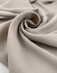 Polyester and elastane cady with textured in white sand, very soft, flowy, and not transparent. High-quality deadstock fabric collected in Stock from a Maison de Couture in Italy.