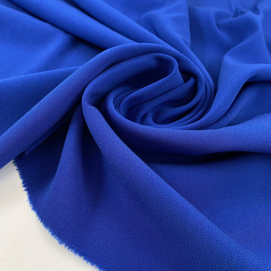 Elettric blue polyester crepe cady very soft, flowy, not transparent. High-quality deadstock fabric collected in Stock from a Maison de Couture in Italy.