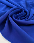 Elettric blue polyester crepe cady very soft, flowy, not transparent. High-quality deadstock fabric collected in Stock from a Maison de Couture in Italy.