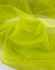 Green, acid lime, polyester organza soft and light. High-quality deadstock fabric collected in Stock from a Maison de Couture in Italy.