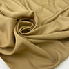 Beige polyester crêpe de chine with a lightweight fluid drape and matte finish ideal for elegant blouses dresses and linings. High-quality deadstock collected in Stock from a Maison de Couture in Italy.