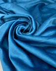 Viscose and polyester velvet in light blue, heavy and structured, very shiny. High-quality deadstock fabric collected in Stock from a Maison de Couture in Italy.