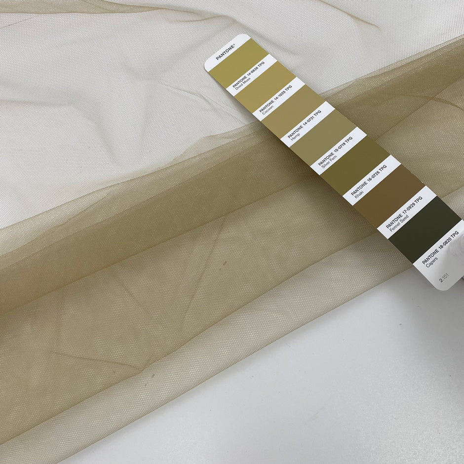 Soft and transparent polyester micro tulle beige. High-quality deadstock fabric collected in Stock from a Maison de Couture in Italy.