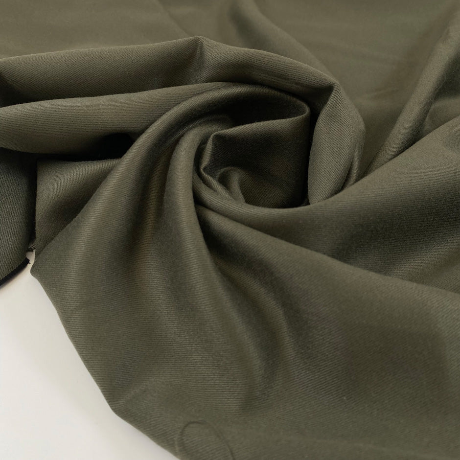 Very soft and flowy viscose/polyester cady in dark olive green, double face and not transparent. High-quality deadstock collected in Stock from a Maison de Couture in Italy.