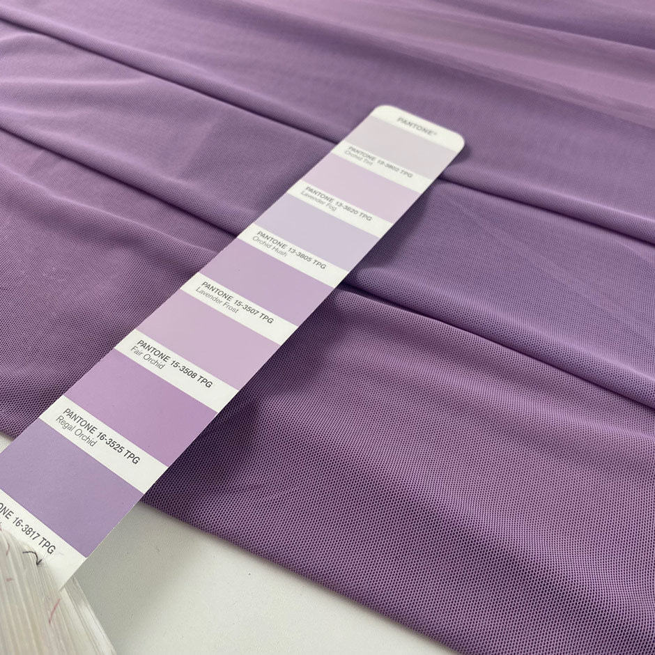 Stretch microtulle in regal orchid. Very light, transparent, flowy and soft – ideal for dresses, underwear, and t-shirts. High-quality deadstock collected in Stock from a Maison de Couture in Italy.