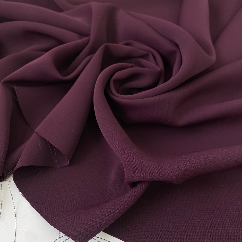 Very soft and smooth polyester cady in grape wine. Flowy and not transparent. Ideal for dresses, trousers, and skirts.
High-quality deadstock collected in Stock from a Maison de Couture in Italy