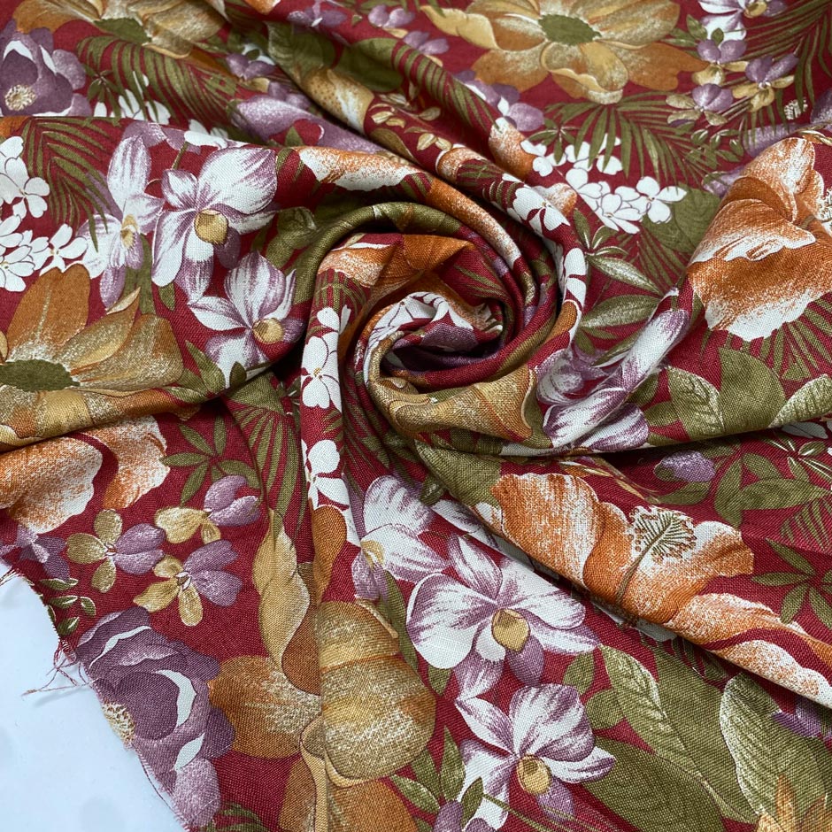 Soft and lightweight cotton and linen blend with a bordeaux base and multicolor floral design. Ideal for dresses, trousers, skirts, and shirting.High-quality deadstock collected in Stock from a Maison de Couture in Italy.