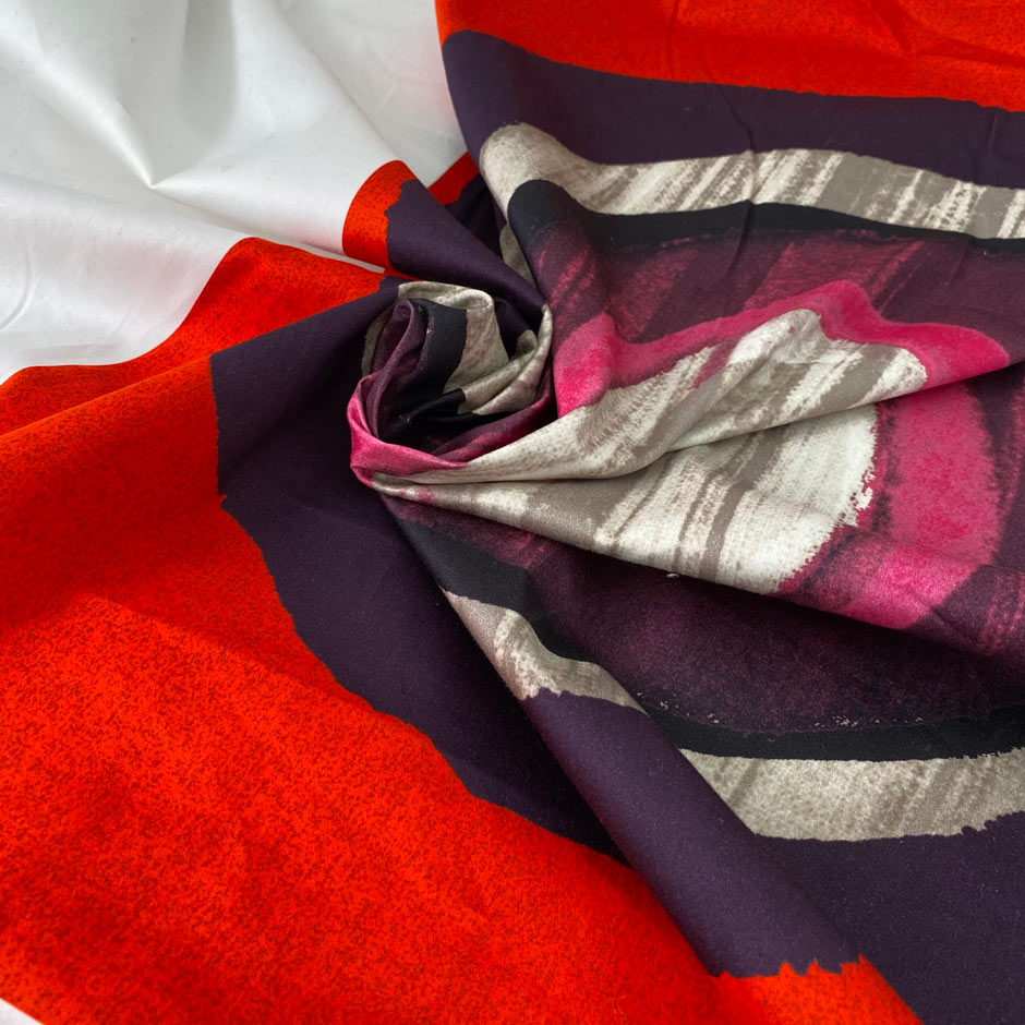 White pure cotton satin with elastane featuring a panel on the edge in rare red, violet, gray and fuchsia. Very soft, flowy and medium weight. Ideal for trousers, skirts and dresses. High-quality deadstock collected in Stock from a Maison de Couture in Italy.