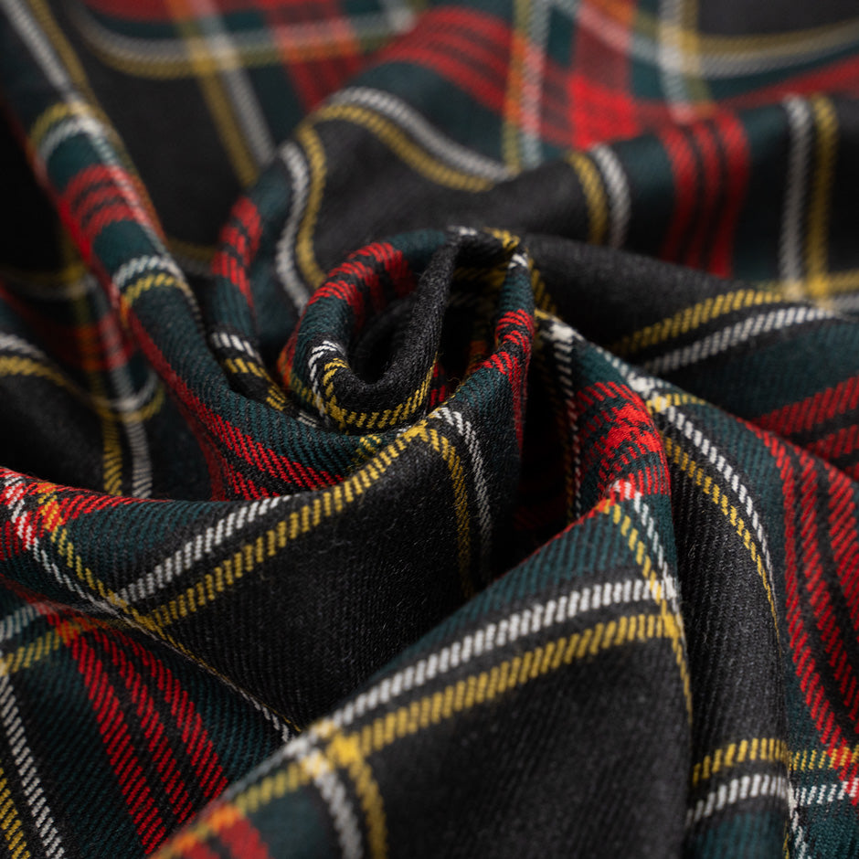 Dark multicolored falling pure wool tartan. High-quality deadstock fabric collected in Stock from a Maison de Couture in Italy.